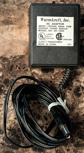 Dv-1260 Warmkraft Inc. Ac Adapter Model Input 120v Output 12v 60hz 600ma