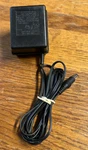 Ac-dc Adapter Shing Wai Co. Model T4145600 120VAC 60HZ To 4.5V 600MA. Fixed Price $8.00.