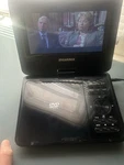 Sylvania SDVD7050 Portable Player 7" Screen Black, Plays Cd, Dc Power. Fixed Price $22.00.