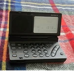 Sony ICF-SW100 Portable Am/fm Shortwave World Band Receiver W/ Case & Ac Adapter. Fixed Price $320.00.